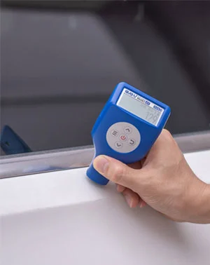 Paint thickness gauge measurement on a vehicle panel